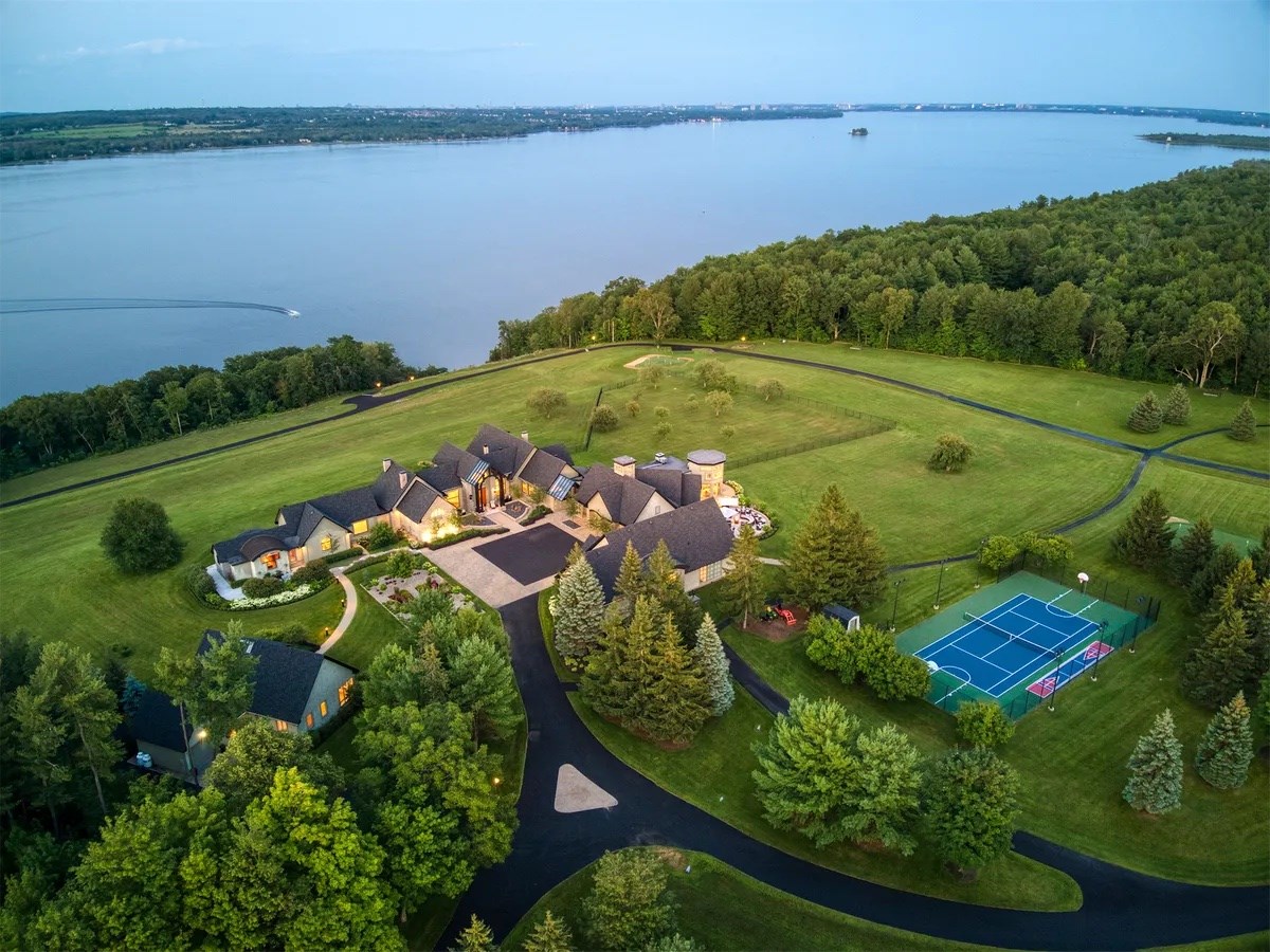Aerial view of lakefront estate at golden hour